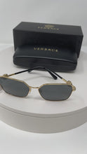 Load and play video in Gallery viewer, Sunglasses by Versace
